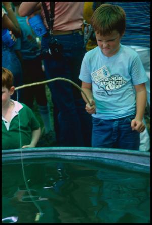 Primary view of object titled '[Boy Fishing with Homemade Fishing Pole]'.