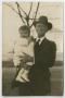 Photograph: [Charles Evans, Sr. Holding a Baby]