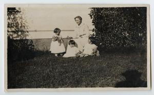 Primary view of object titled '[The Evans Family Relaxing Outdoors]'.