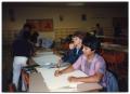 Photograph: [Teenagers Writing and Drawing at Poster Art Contest]