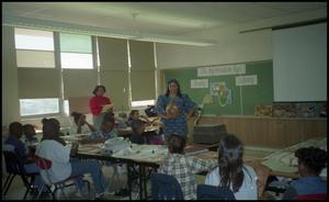 Primary view of [Woman Presenting in Gates Elementary Classroom]
