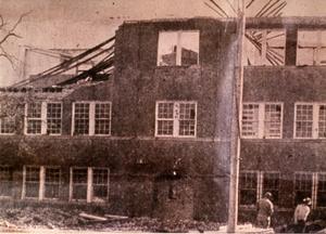 Primary view of object titled 'Brick School Building Being Torn Down'.