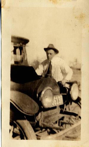 Primary view of object titled 'C. P. Schulze, Sr., by His Car'.