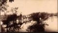 Primary view of Railroad Survey Crew Poses on Bridge Across Creek, c. 1902
