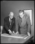 Photograph: Two architects at table