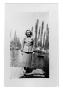 Photograph: Woman stands on a dock
