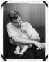 Photograph: Charles Delphenis holding his baby son Ray