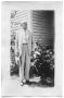 Photograph: Henry Scrivner standing outside a house