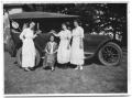Primary view of Dallie Scrivner, Sammie Vise, Allie Conrady and Neely Scrivner stand next to a Cadillac