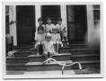 Photograph: The Delaney and Vise children sitting on the steps of a house