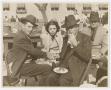 Photograph: [Men and Woman at Barbecue]