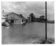 Photograph: [Photograph of Wooden Building on the River]