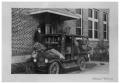 Photograph: [Automobile Parked outside of Post Office]