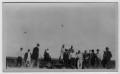 Primary view of [group of men around tractor and plow on Frank Butler Farm]