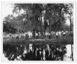 Photograph: [Photograph of Group of People Standing near a Body of Water]