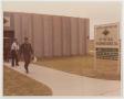 Photograph: [Lt. Colonel Reed Exiting Building]