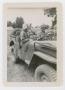 Photograph: [Lieutenant and Women in a Jeep]