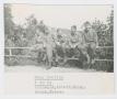 Photograph: [Soldiers Sitting on Fence]