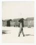 Primary view of [Man Walking Through Snow]