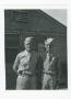 Photograph: [Soldiers Posing In Front of Barracks]