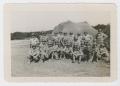 Photograph: [Men In Front of Camouflage Netting]