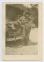 Photograph: [Noble Grubbs Standing by Major General's Staff Car]