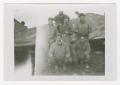Photograph: [Six Soldiers Posing Beside a Vehicle]