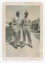 Thumbnail image of item number 1 in: '[Dan Melli and Another Soldier Standing in Front of Tents]'.