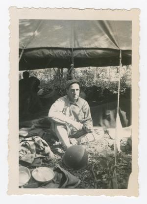 Primary view of object titled '[Soldier Sitting Under a Tent]'.