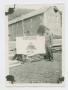 Thumbnail image of item number 1 in: '[Arthur Fonjemie Standing by a 12th Armored Division Sign]'.