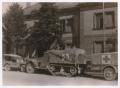 Photograph: [Command Post Half-Track with a Trailer in Courtyard]
