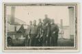 Photograph: [Six Soldiers Posing with Scout Car at Camp Campbell]