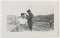 Photograph: [Two Soldiers Engaging in a Hair Cut]