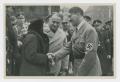 Photograph: [Adolf Hitler Speaking to a Couple]