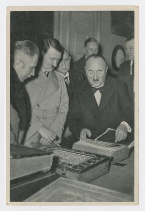 Primary view of object titled '[Hitler and Others Looking at Books]'.