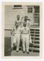 Photograph: [Four Men Standing on a Building's Steps]