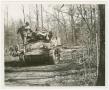 Photograph: [Soldier Mounting an M5A1 Light Tank ]