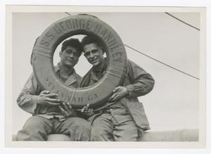 Primary view of object titled '[Marion and William Heiden Holding a Life Preserver]'.