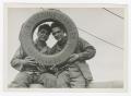 Photograph: [Marion and William Heiden Holding a Life Preserver]