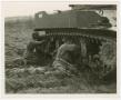 Photograph: [Soldiers Working on the Track of a M5A1 Light Tank]