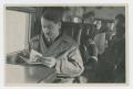 Photograph: [Adolf Hitler Reading]