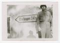 Photograph: [Sergeant Standing by Sign Pointing to Dischingen, Germany]