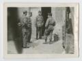 Photograph: [Four Soldiers Standing at Building Entrance]
