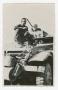 Primary view of [Albert Winder on the Hood of a Half-Track]