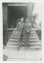 Photograph: [Two Soldiers Standing on Steps]
