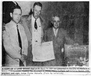 Primary view of object titled 'Newspaper article of Marfa rotarians presenting city with old land grant'.