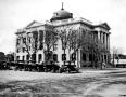Photograph: [Courthouse with Model T's out front]