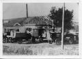Photograph: [Round Rock Cheese Factory with Cars & Trucks]