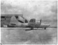 Photograph: B-32 plane, side view, on the ground.