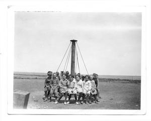 Primary view of object titled '[Llano School students on a merry-go-round]'.